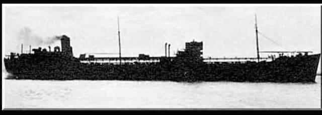 Vintage cargo ship on the water.