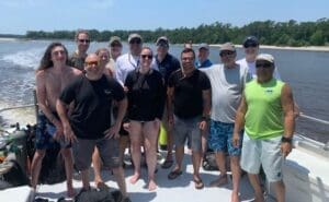 Group of people on a boat outdoors.