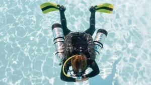Top-down scuba diver with twin tanks